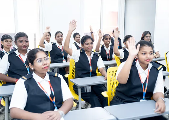 Aviation students raising hands in a classroom session at one of the best aviation colleges in Tamilnadu, Chennai